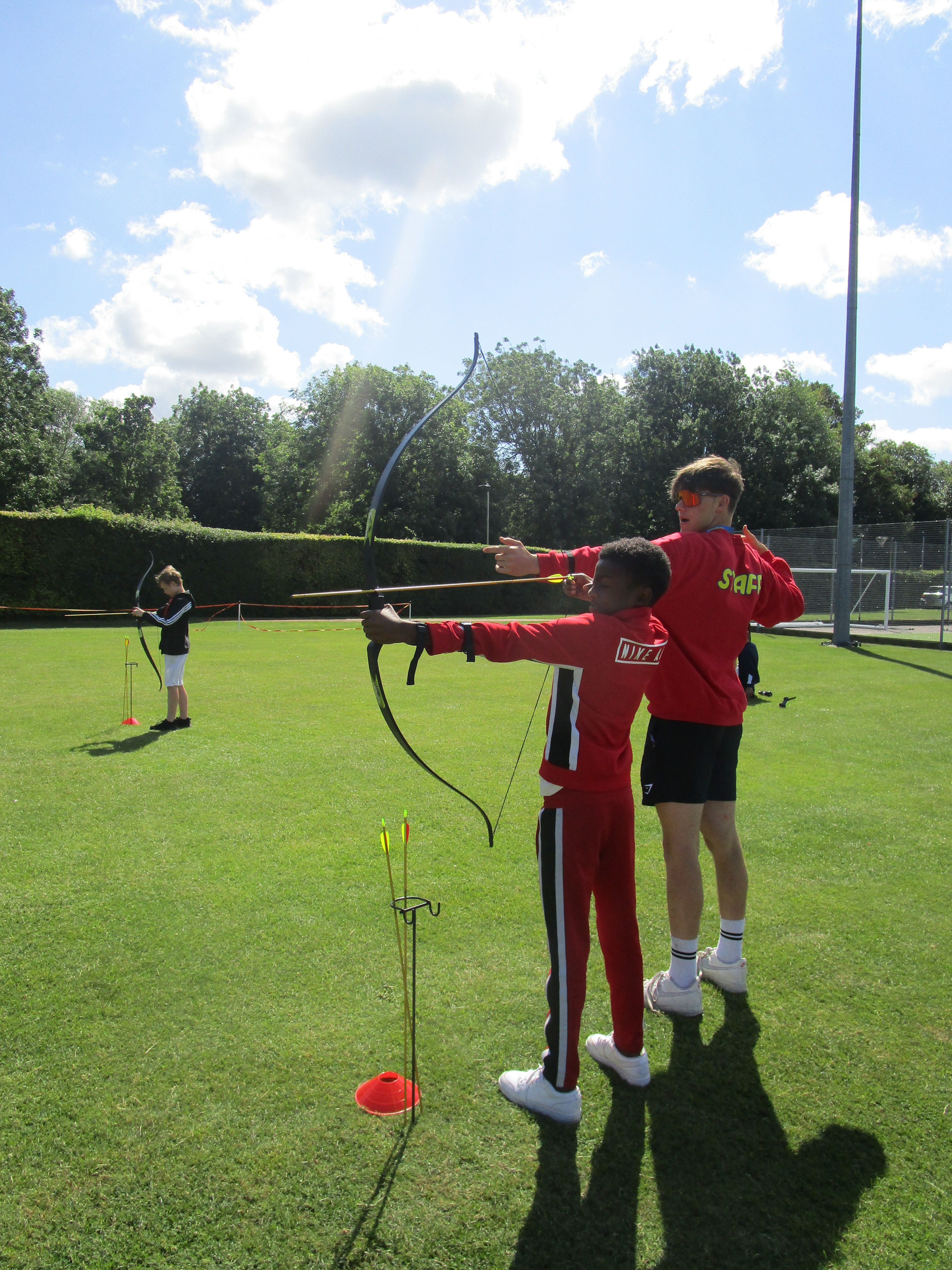 Barracudas camp staff leading archery session.jpg