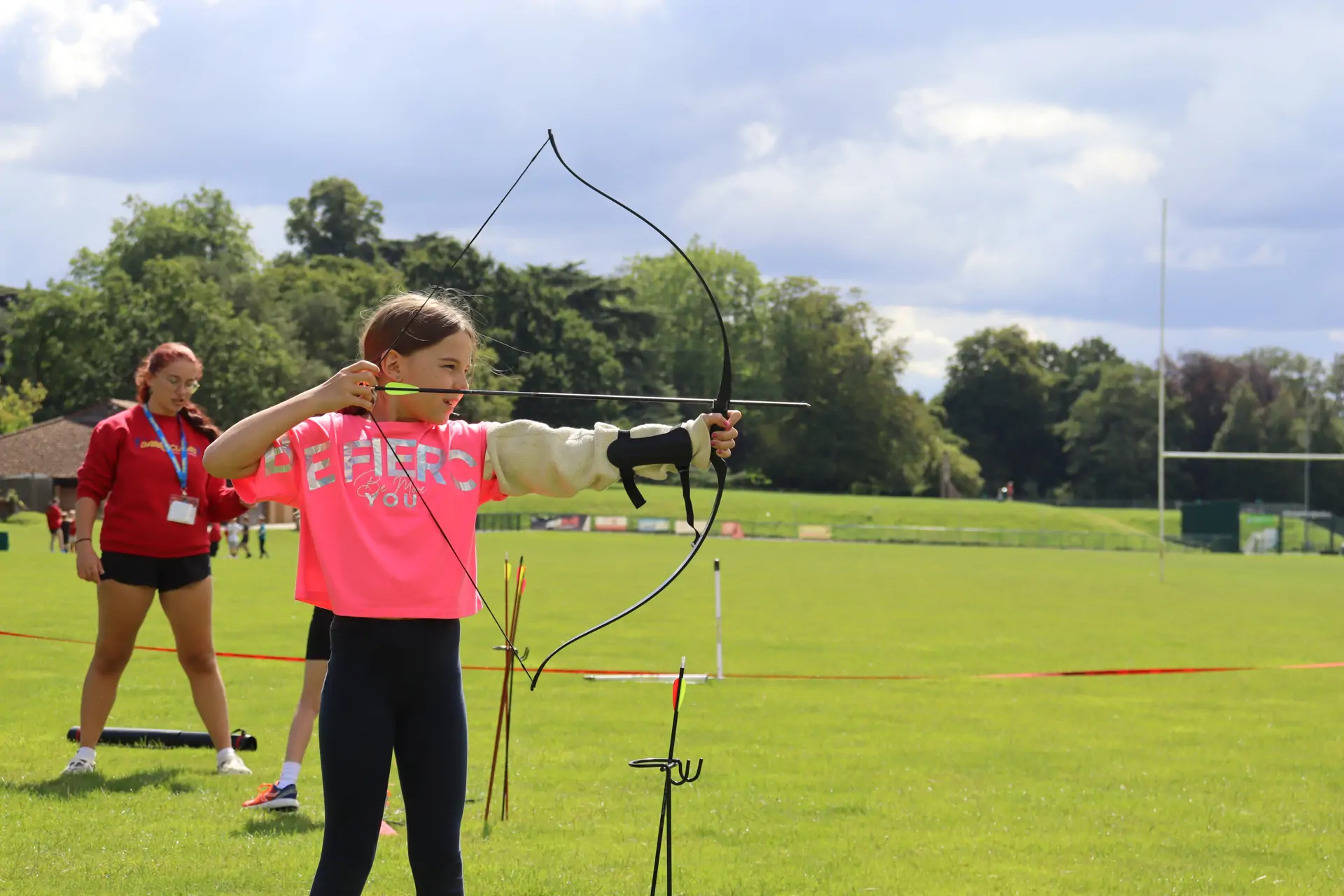 Barracudas camp archery girl.jpg
