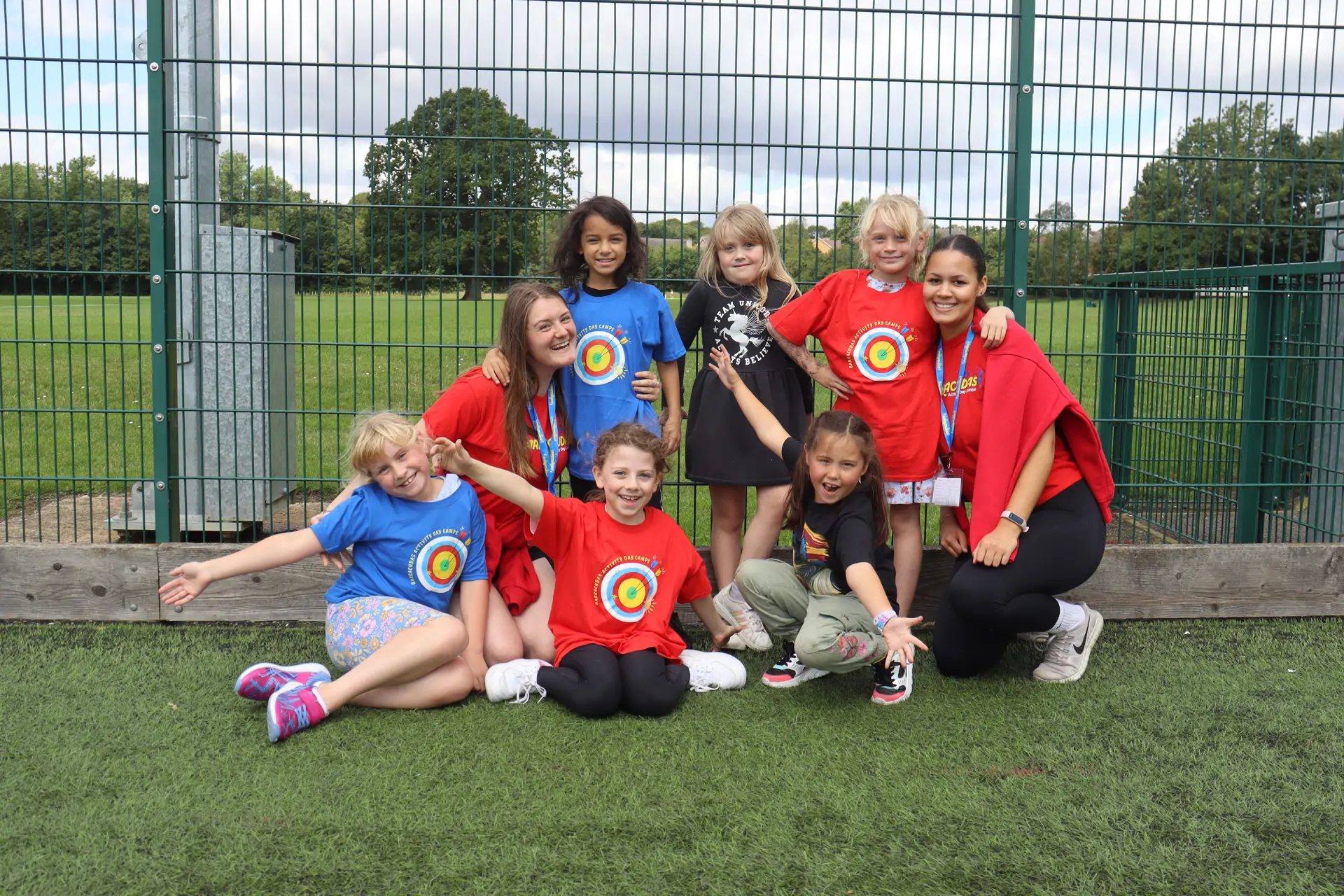 Staff with girls in target camp kit.jpg