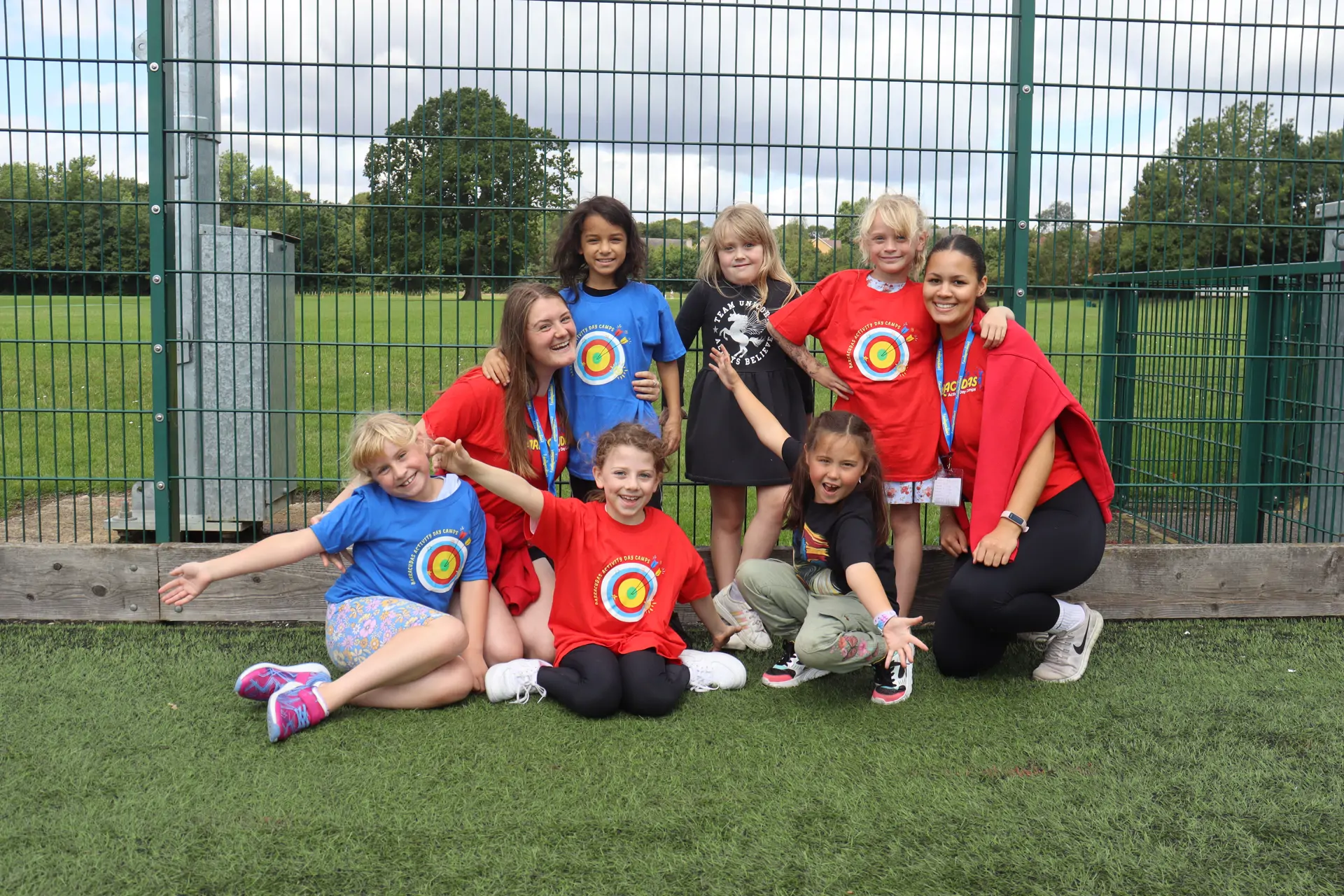 Staff with girls in target camp kit.jpg