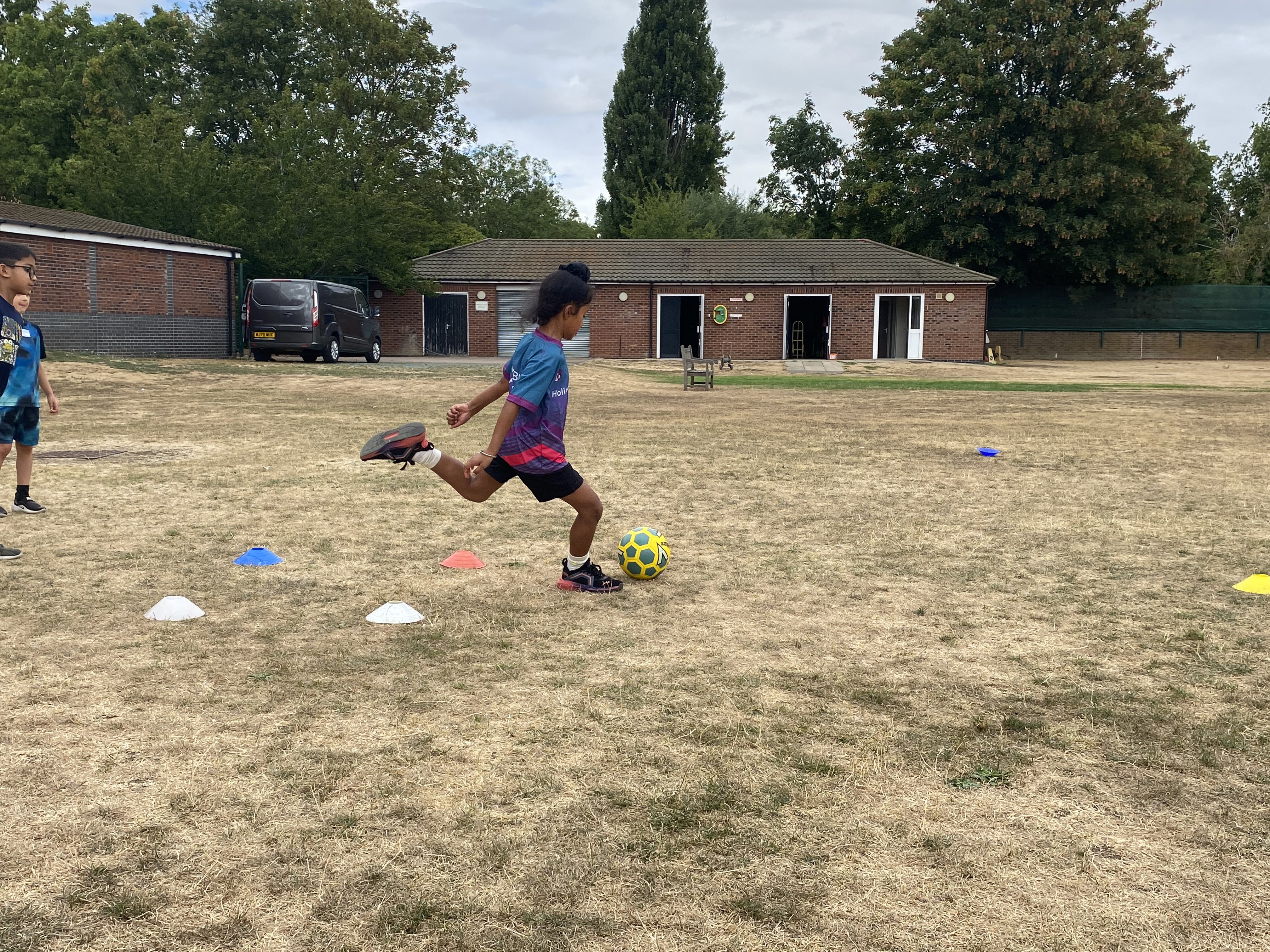 Girl showing football skills at Barracudas Bedford camp.jpg