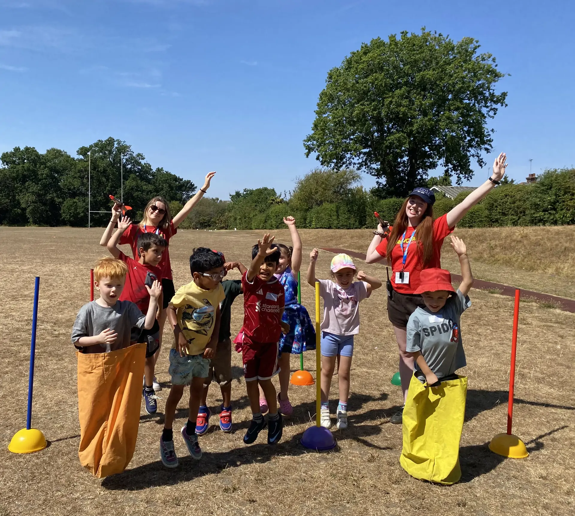 Barracudas Barnet camp cheering kids on the field.jpg