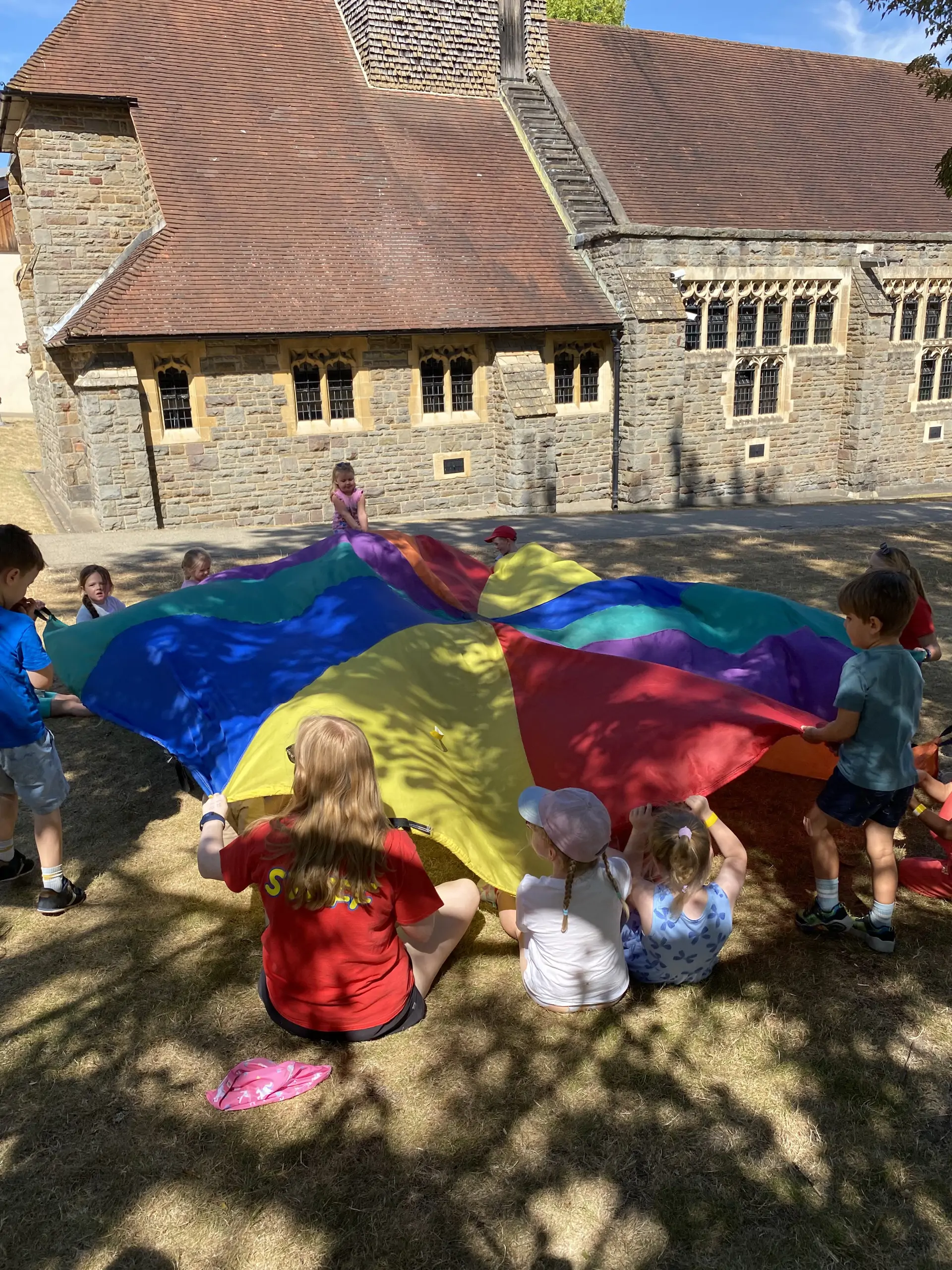 Parrachute games at Barracudas High Wycombe camp.jpg