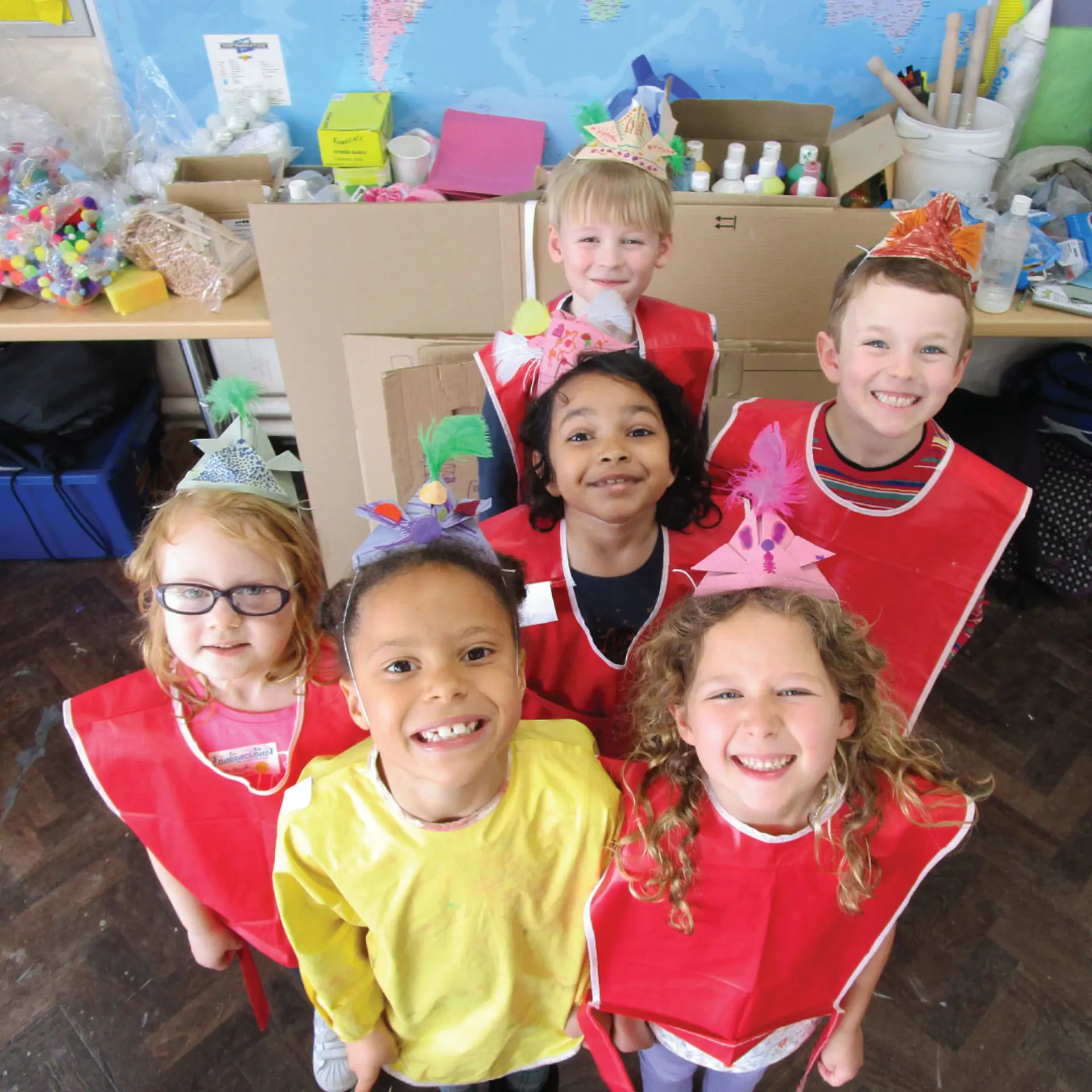4-5 arts and crafts group in bibs and hats.jpg