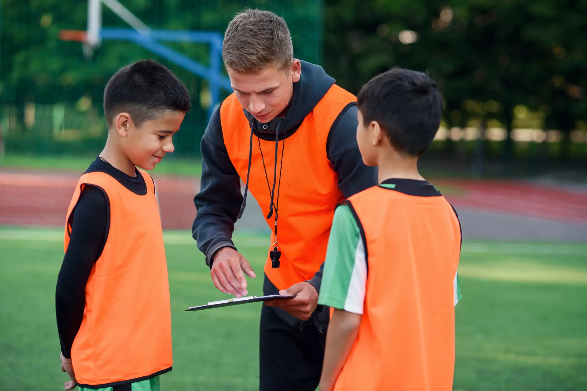 football coach with boys landscape.png