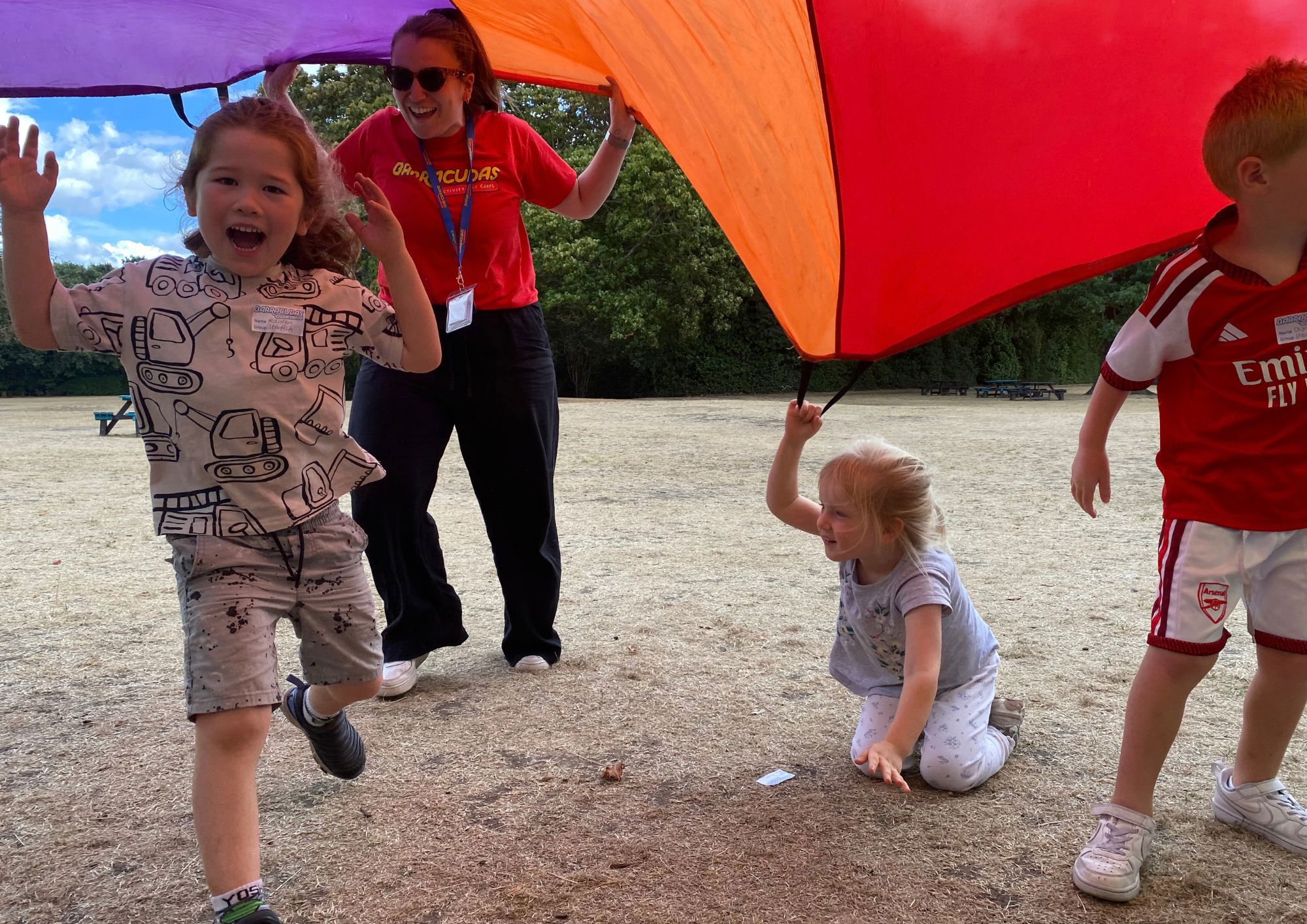 Barracudas Maidenhead camp staff and child parachute games