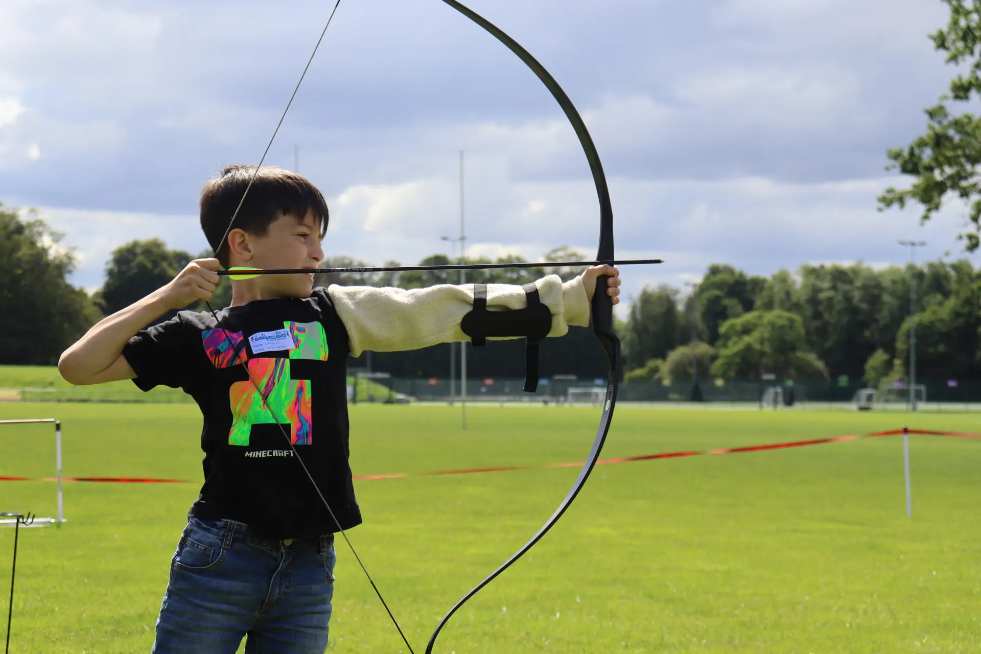 Barracudas camp archery boy.jpg