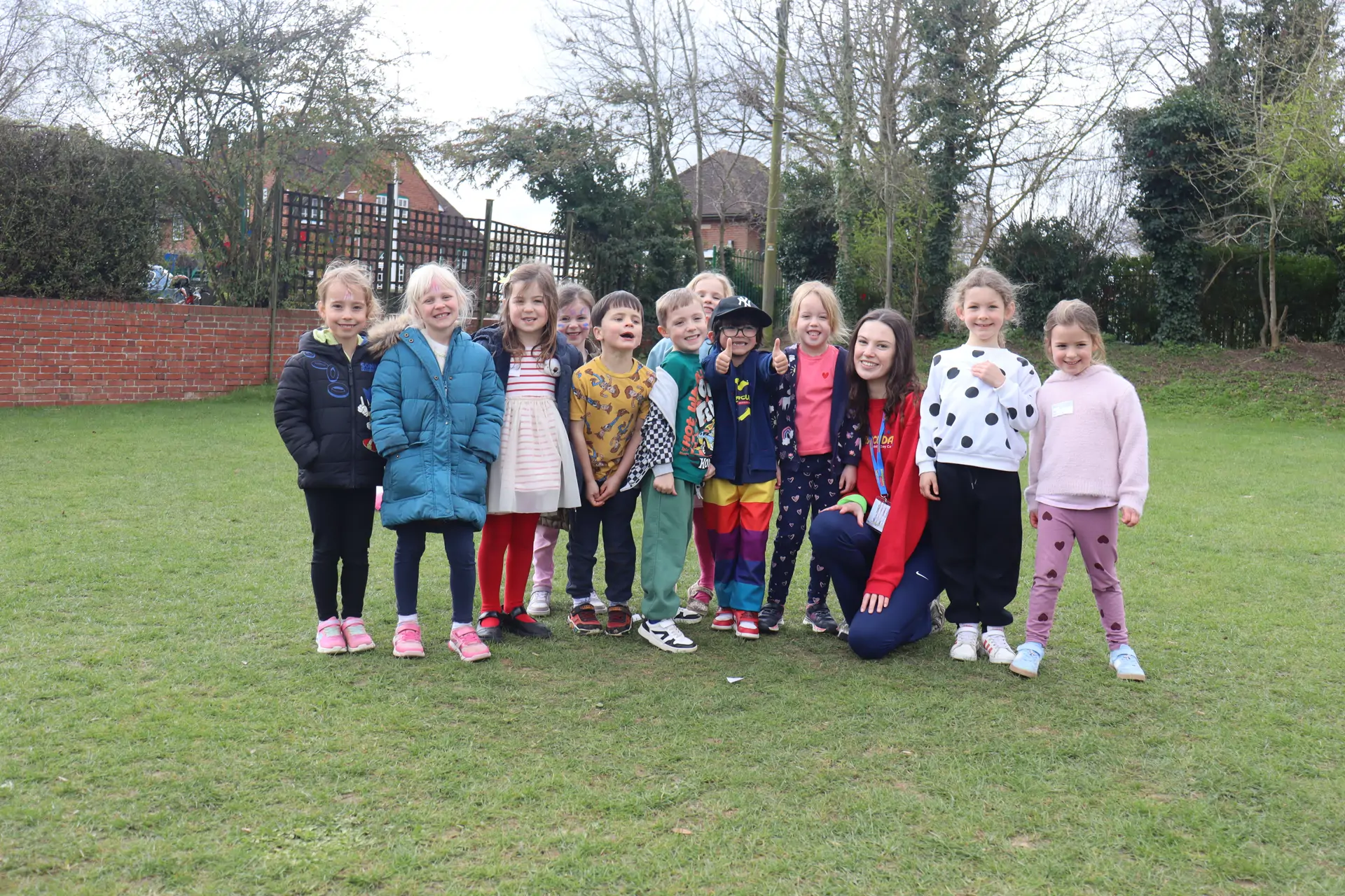 Barracudas camp Letchworth children smiling on grass